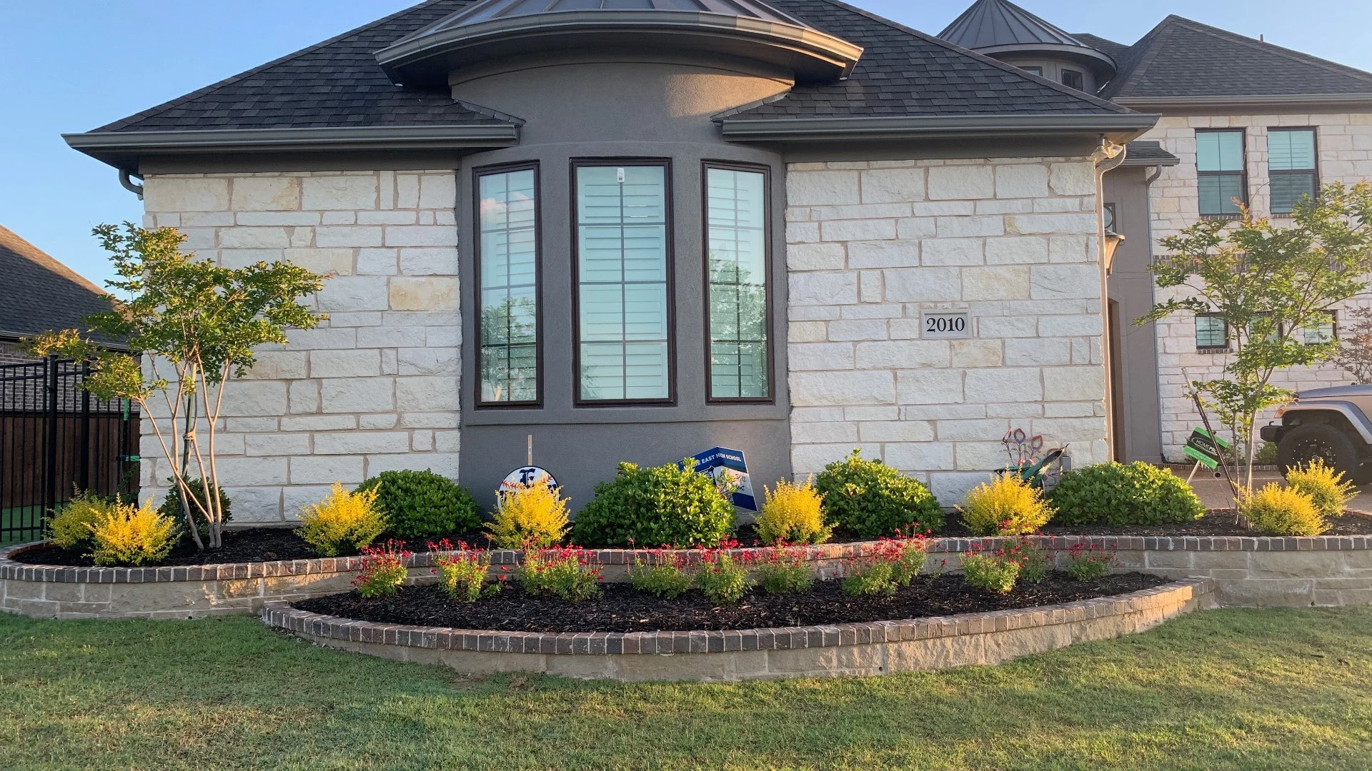 House in Plano, TX with landscaping.
